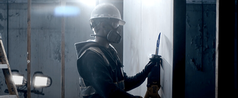 An image of a man using a DEMOWOLF Reciprocating Saw Blade